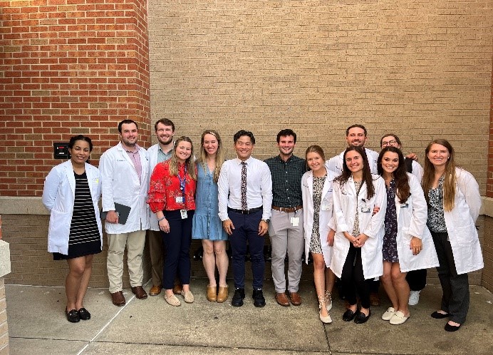 Dr. Benny Wu, September Grand Rounds speaker, pictured with Dermatology's residents.